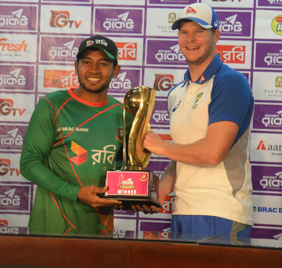 Captain of Bangladesh National Cricket team Mushfiqur Rahim (left) and Captain of Australia National Cricket team Steve Smith pose for a photo session with the trophy of the two-Test series between Bangladesh and Australia, at the conference room of Sher-