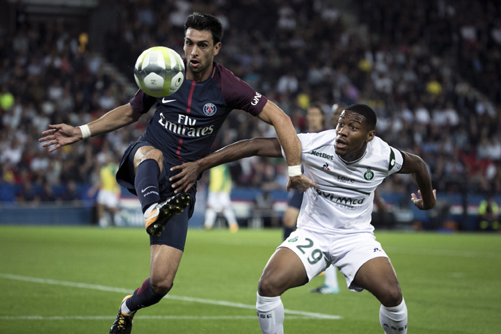 PSG's Pastore (left) struggles for the ball with Saint Etienne's Ronael Pierre Gabriel during the French League One soccer match between Paris Saint Germain and Saint Etienne at the Parc des Princes stadium in Paris, France on Friday.