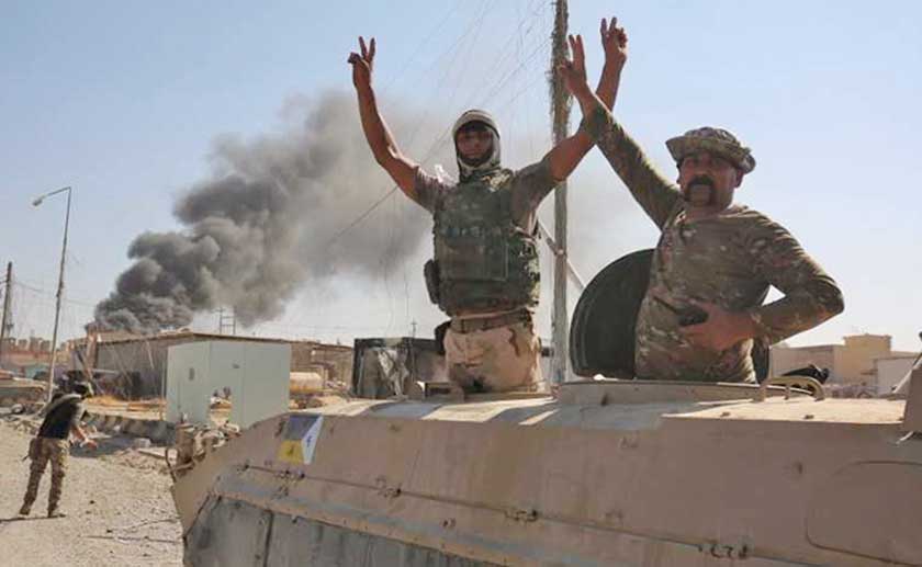 Iraqi forces celebrate after driving out ISIS fighters from Tal Afar.