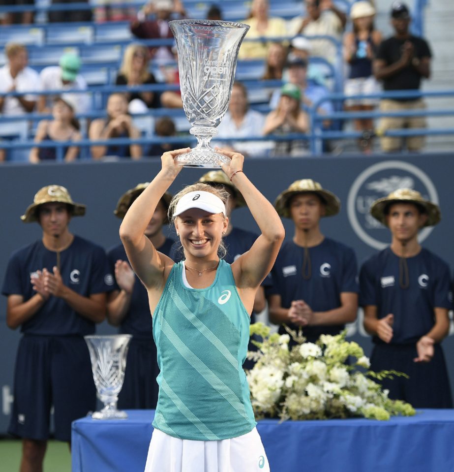 Daria Gavrilova of Australia holds the trophy after her 4-6, 6-3, 6-4 victory over Dominika Cibulkova of Slovakia in the final of the Connecticut Open tennis tournament in New Haven, Conn. on Saturday.