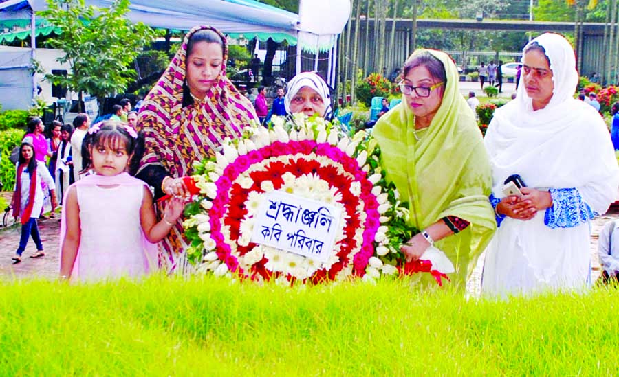 Family members of the National Poet Kazi Nazrul Islam paying tributes to the poet placing floral wreaths at the mazar of the poet in the city on Sunday marking his 41st death anniversary.