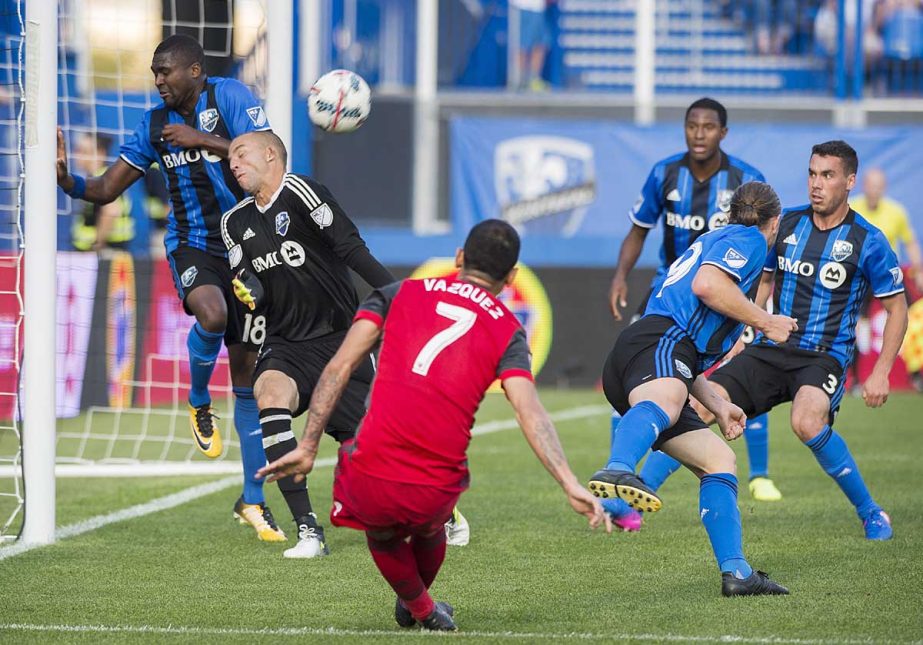 Toronto FC's Victor Vazquez (7) takes a shot on Montreal Impact's goalkeeper Evan Bush during second half MLS soccer action in Montreal on Sunday.