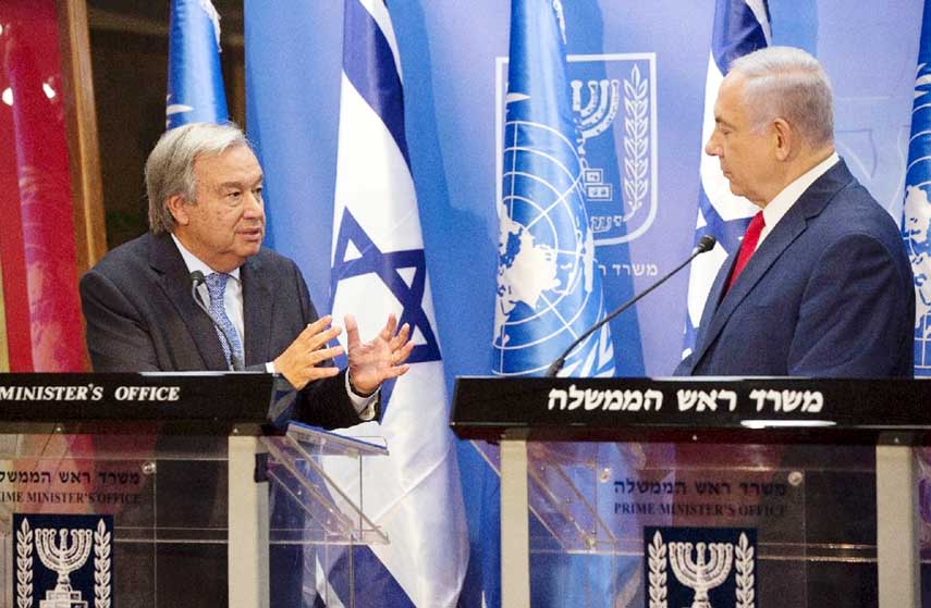 UN Secretary General Antonio Guterres (L) speaks to Israel's Prime Minister Benjamin Netanyahu on his first visit since taking office .