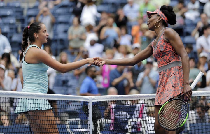 Venus Williams of the United States shakes hands with Viktoria Kuzmova of Slovakia after winning their first round match of the U.S. Open tennis tournament on Monday in New York.