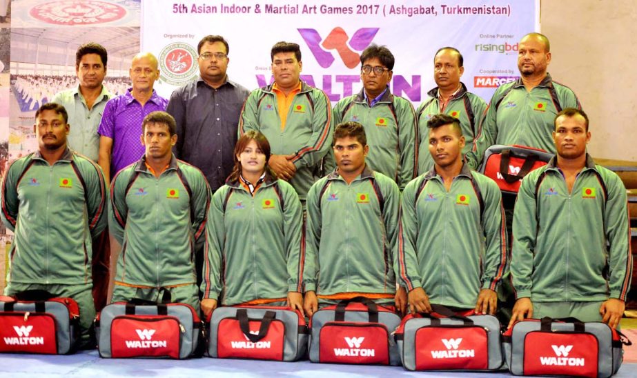 Bangladesh Wrestling team with Operative Director (Head of Sports & Welfare Department) of Walton Group FM Iqbal Bin Anwar Dawn (middle of the second row) pose for a photo session at the gymnasium of National Sports Council on Tuesday.