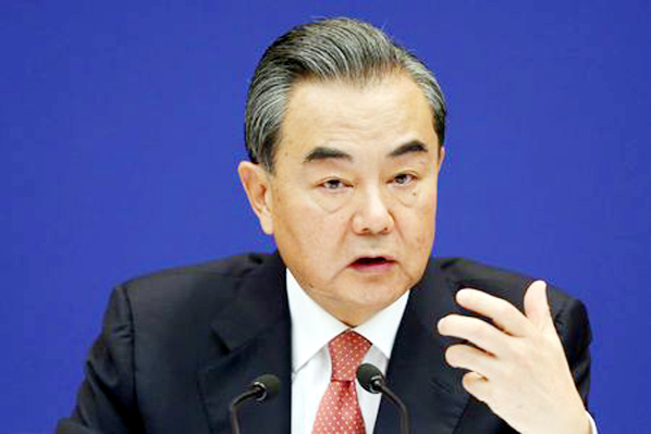 Chinese Foreign Minister Wang Yi holds a news briefing ahead of the 9th BRICS Summit, in Beijing on Wednesday.