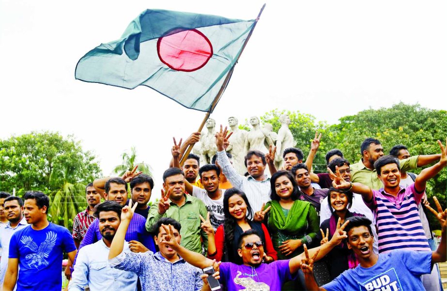 The fans of Bangladesh National Cricket team celebrating after Bangladesh earning the maiden Test victory against Australia in Dhaka on Wednesday. This photo was taken in front of Raju Memorial Sculpture in Dhaka University campus.