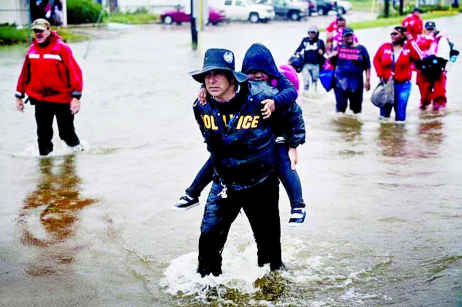 Residents were continuing to be evacuated from flooded neighbourhoods of Houston on Tuesday.