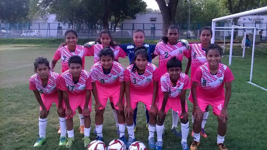 Players of BKSP Under-17 Women's Football team, the champions of the Subroto Mukherjee Cup Under-17 International Football Tournament pose for a photo session at the Ambedkar Stadium in New Delhi, India on Friday.