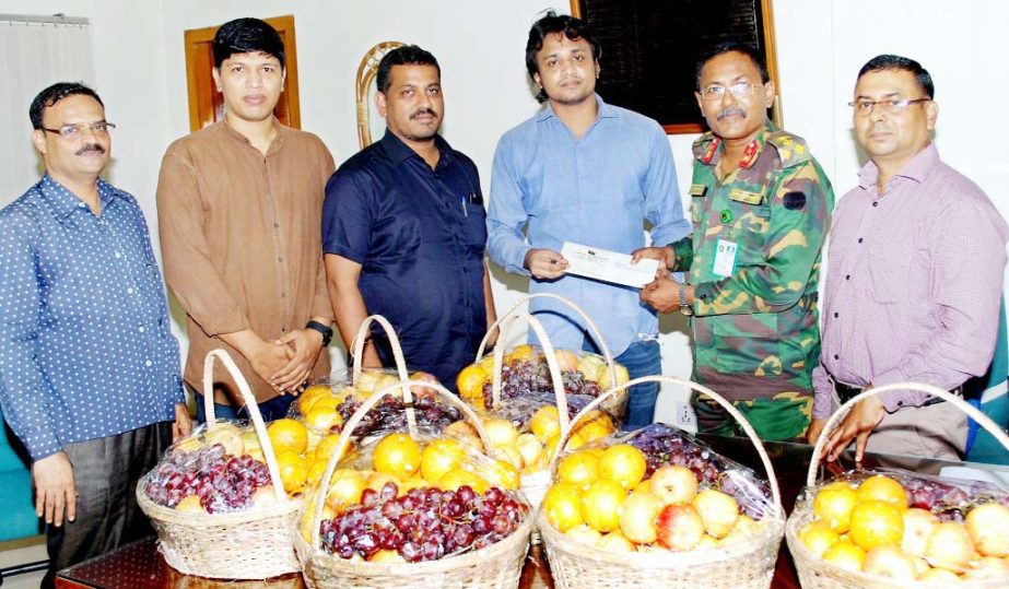 Brig Gen Md Jalal Uddin receiving fruits donated by Alhaj A B M Mohiuddin Ahmed Chowdhury, President, Chittagong City Awami League for sick and injured Rohingyas at Chittagong Medical College Hospital recently.