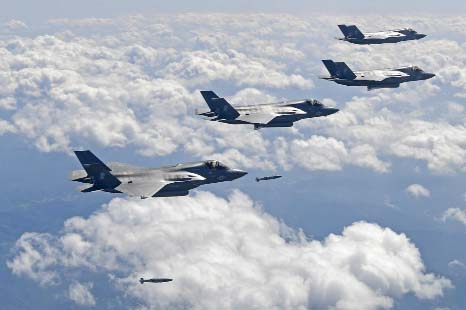 US Air Force F-35B stealth fighter jets drop bombs as they fly over the Korean Peninsula during a joint drills with South Korea on Monday.