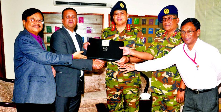 Nizamuddin Rajesh, Acting President of Federation of Bangladesh Chambers of Commerce and Industry, handing over 10 laptops to Major General Md. Masud Rezwan, Director General of Department of Immigration and Passport at its head office in the city on Mond