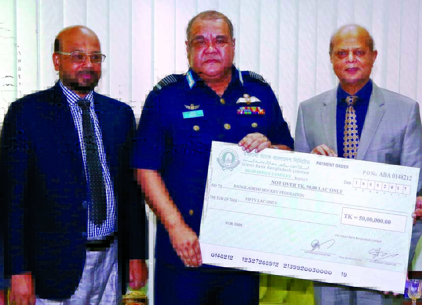 Md. Abdul Hamid Miah, Managing Director of Islami Bank Bangladesh Limited, handing over a cheque of Tk 50 lakh for upcoming 'Asia Cup Hockey Tournament' to Air Chief Marshal Abu Esrar, President of Bangladesh Hockey Federation at Air Force Headquarters