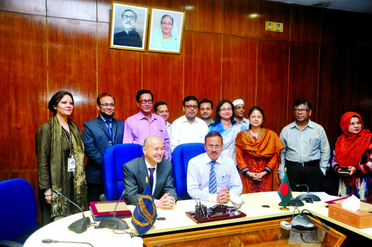 Secretary of Economic Relation Division Kazi Shafiqul Azam and Country Director of Bangladesh Residence Mission Kazuhiko Higuchi at a deal signing ceremony at NEC-2 Conference Room of Planning Commission in the city's Agargaon on Tuesday.