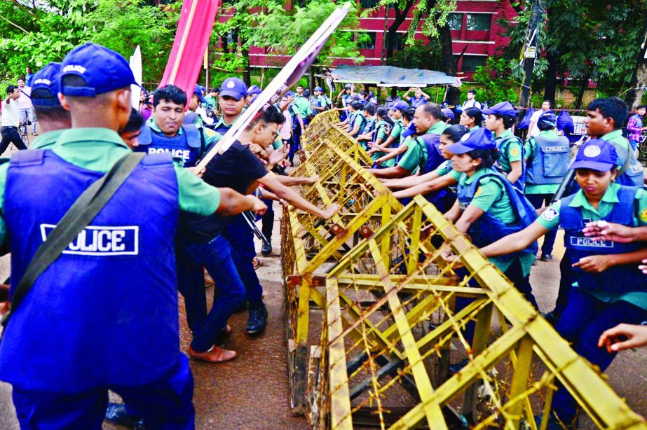 A procession brought out on Tuesday by Gono Songhoti Andolon, a left leaning organisation to put international pressure on Myanmar was intercepted by police in front of the United Nations, Dhaka office.