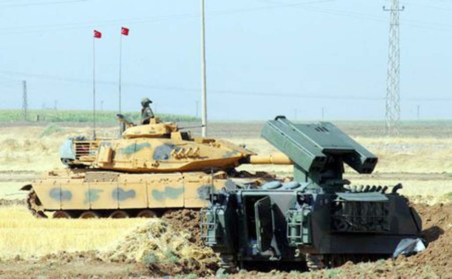 A Turkish soldier on a tank is seen during a military exercise near the Turkish-Iraqi border in Silopi, Turkey.