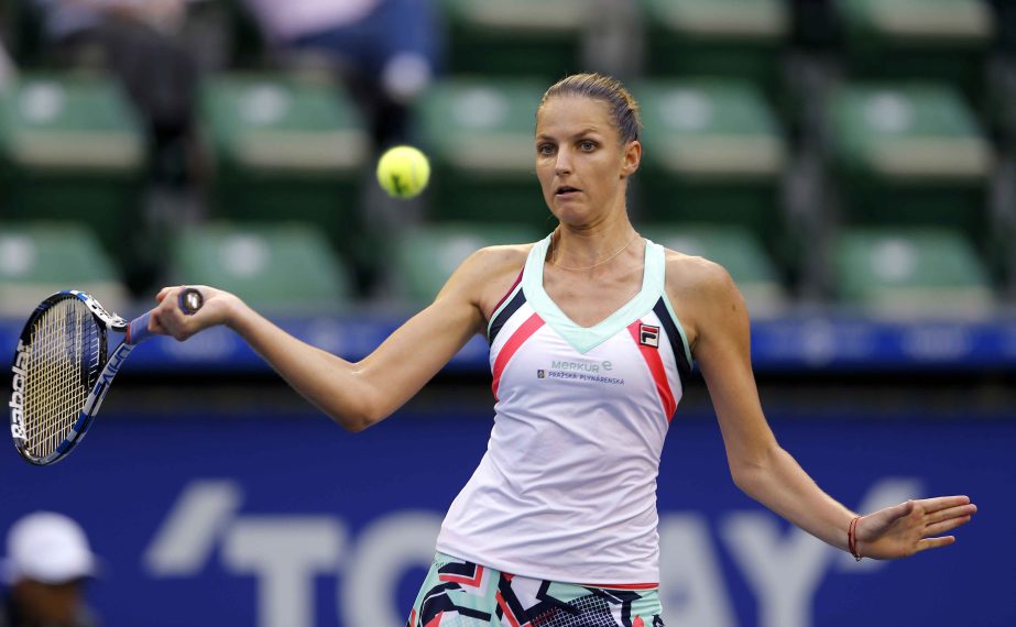 Karolina Pliskova of the Czech Republic returns a shot to Magda Linette of Poland during their second round match of the Japan Pan Pacific Open tennis tournament in Tokyo on Wednesday.