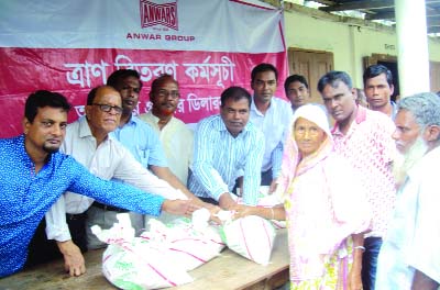 GANGACHARA (Rangpur): Relief goods were distributed among the flood-hit people at Kolkonda Upazila organised by Anawar Group recently.