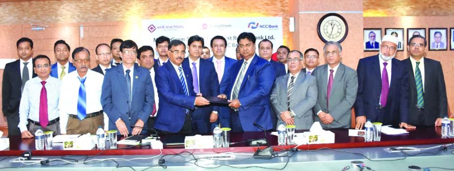 Mosleh Uddin Ahmed, Managing Director of NCC Bank Limited and Md. Ataur Rahman Prodhan, Managing Director of Rupali Bank Limited, exchanging an agreement signing documents at the bank head office on Thursday. Under the deal, Rupali Bank will disburse fore