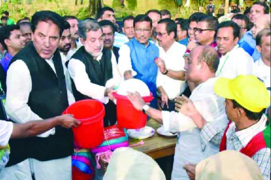 Chairman of the Parliamentary Standing Committee on Ministry of Railway ABM Fazle Karim Chowdhury MP along with Minister for Road Transport and Bridges Obaidul Quader MP and former state Minister Jahangir Kabir Nanak among others seen distributing relie