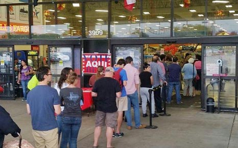 Voters line up outside the Fiesta supermarket in Austin, Texas on November 8, 2016.