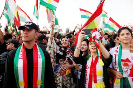 Kurds celebrate to show their support for the upcoming independence referendum in Erbil on Friday.