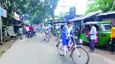 KULAURA(Moulvibazar): Girls are going school by riding bicycle in Kamalganj Upazila.