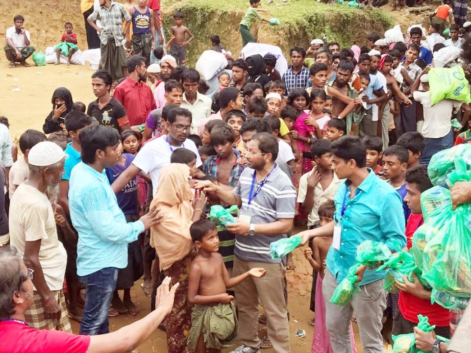 Kidney Awareness Monitoring and Prevention Society (KAMPS), a voluntary health care organisation distributing relief materials at Ukhiya Rohingya refugee camps in Cox's Bazar on Thursday.