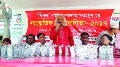 GAZIPUR: Renowned musician of Swadhin Bangla Betar Kendra Monoranjan Ghosal addressing the 3rd Inter-school Cultural Competition organised by Dibos Foundation at Gacha School premises at Gazipur on Friday.