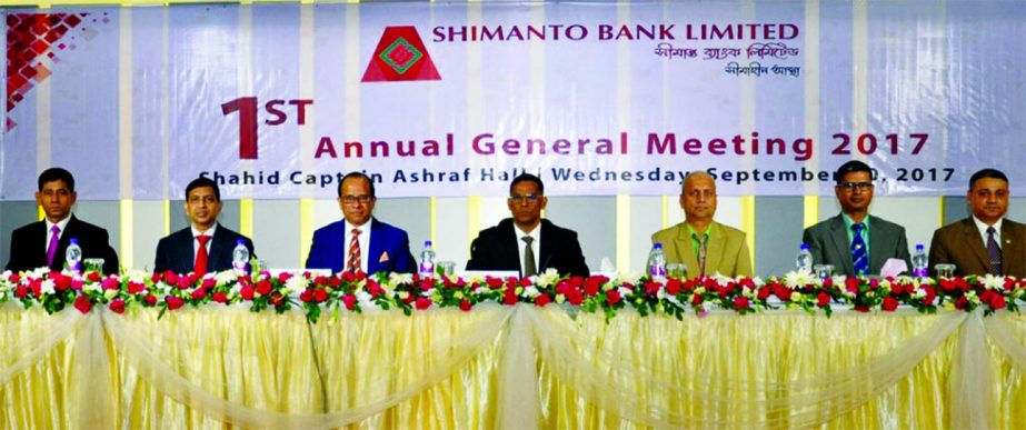 Major General Abul Hossain, Chairman of Shimanto Bank Limited and Director General of Border Guard Bangladesh (BGB), presiding over the 1st AGM of the bank at BGB head quarters in the city on Wednesday. Mukhlesur Rahman, Managing Director and Directors of