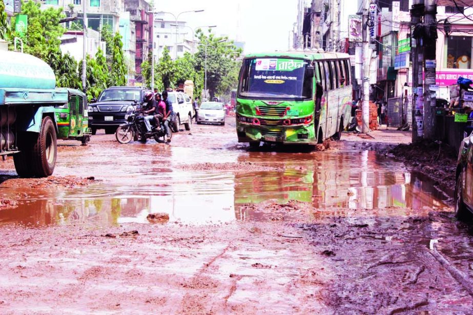 Pothole strewn road from Rampura to Malibag now in a sorry state, but the authorities concerned seemed to be blind to repair the road to mitigate the woes of the road users. The snap was taken from the city's Malibag Chowdhurypara on Sunday.