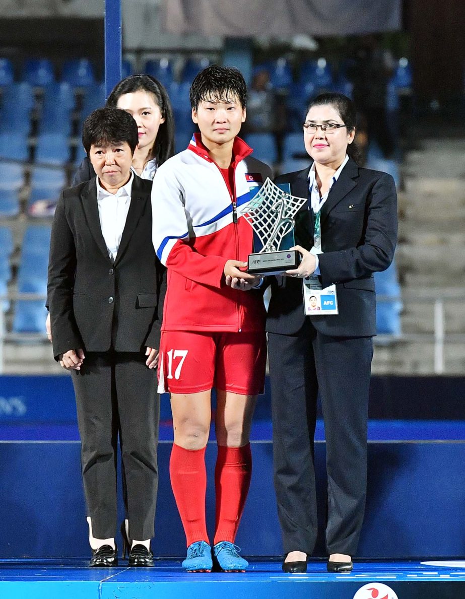 Member of FIFA Mahfuza Akter Kiron handing over the prize to a winner of the AFC Under-16 Women's Championship at Chonburi in Thailand recently.