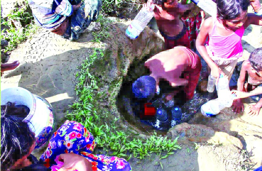 Rohingya people, who took shelter at refugee camps, are facing acute crisis of pure drinking water fearing spread of water-borne diseases. A Rohingya child is seen collecting water from a well in Hoaikang area under Teknaf Upazila of Cox's Bazar district
