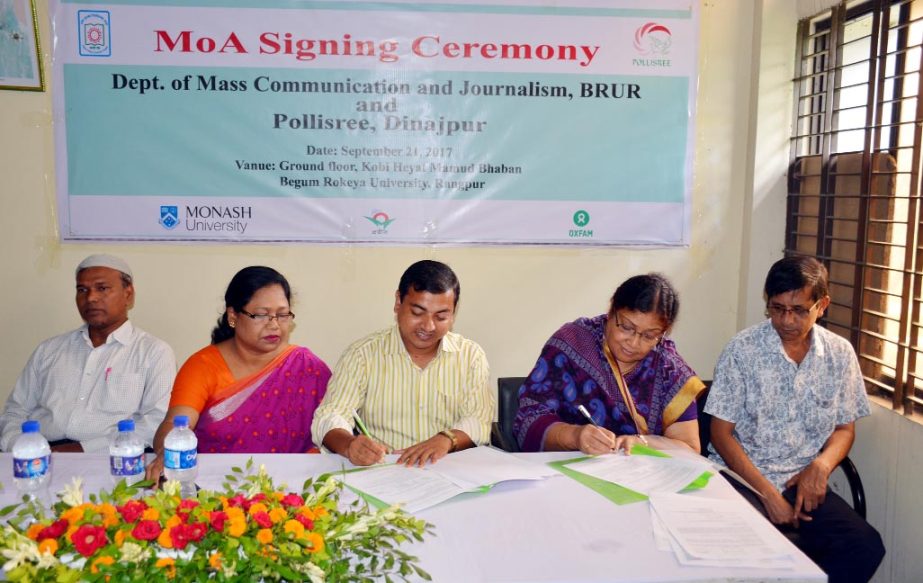 Prof Dr Nazrul Islam, Chairman of Department of Mass Communication and Journalism of Begum Rokeya University and Pollisree Executive Director Shamim Ara Begum signing an agreement for women empowerment in favour of their respective organizations at the Un