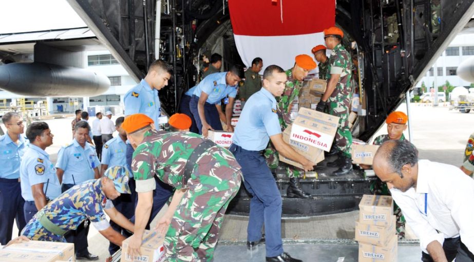 Bangladesh Air Force members unloading foreign relief goods for Rohingyas at the Port City recently.