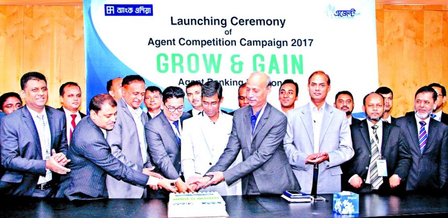 Md. Arfan Ali, Managing Director of Bank Asia Limited, inaugurating Agent Banking Customer Acquisition campaign 'Grow and Gain' at the bank's head officer in the city on Saturday. Mian Quamrul Hasan Chowdhury, DMD, Mohammed Borhanuddin, Senior Executiv
