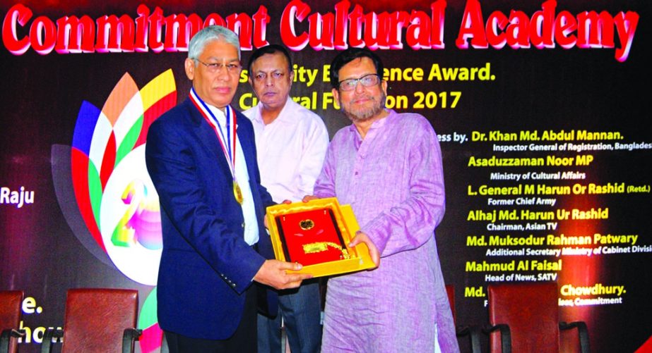 Mir Mahfuzur Rahman, Director of Mir Fashion Wear Ltd, receiving Gold Medal and crest from Cultural Affairs Minister Asaduzzaman Noor MP for his special contribution as the best educationist at IDEB in the city recently.