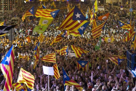 Thousands cheer and wave esteleda, or Catalonia independence flags, during the 'Yes' vote closing campaign in Barcelona, Spain on Friday.