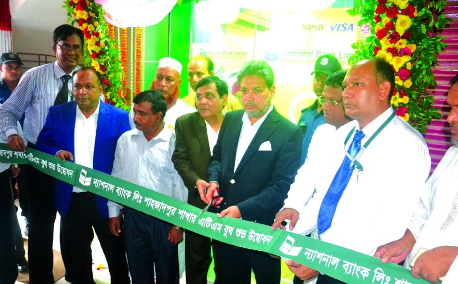Choudhury Moshtaq Ahmed, Managing Director of National Bank Limited, inaugurating it's an ATM booth at Shahjadpur Branch in Sirajgong recently. Wasif Ali Khan, AMD, Md. Ali Haider Mortuza, Vice-President of the bank and local businessmen were also presen