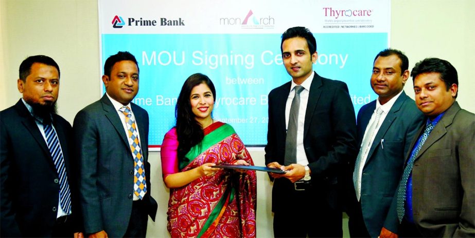 Shaila Abedin, head of Segment Consumer Banking Division of Prime Bank Limited and Ronald Micky Gomes, Chief Operating Officer of Thyrocare Bangladesh Limited, exchanging an MoU signing documents at the bank's head office in the city recently. Under the