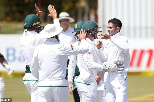 South African bowler Keshav Maharaj (right) celebrates the dismissal of Bangladesh batsman Sabbir Rahman during their Test match in Potchefstroom on Monday.