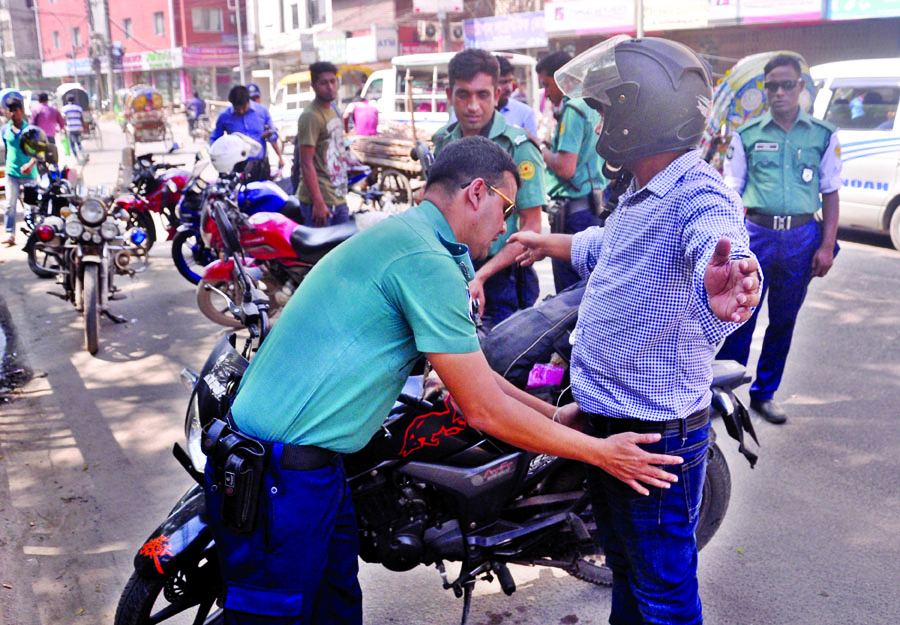 Checking by lawenforcers geared up in the city . This picture was taken from R K Mission Road yesterday.