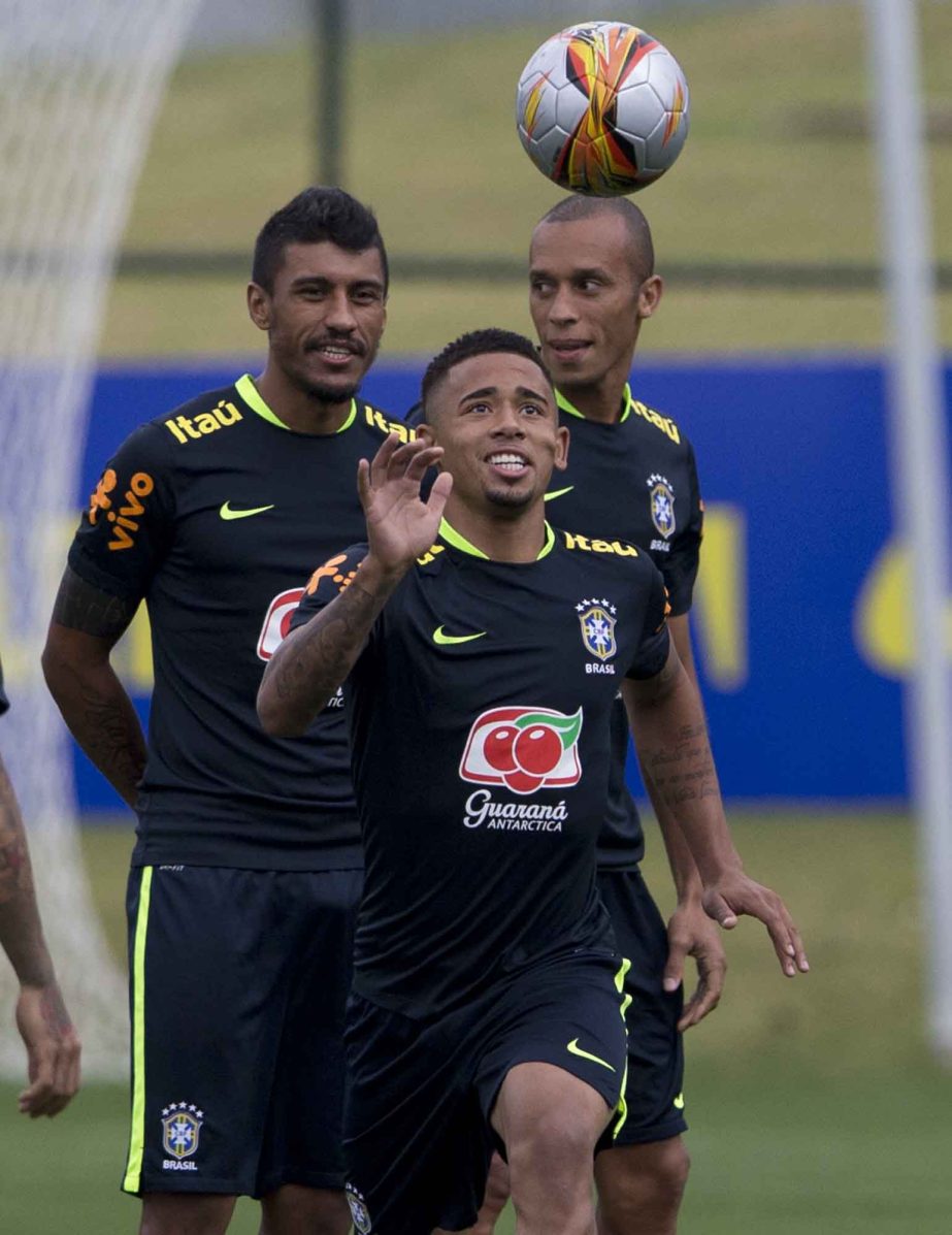 Brazil's Paulinho (left) Gabriel Jesus (center) and Miranda train during a practice session of the national soccer team in preparation for an upcoming World Cup qualifying match in Teresopolis, Brazil on Tuesday.