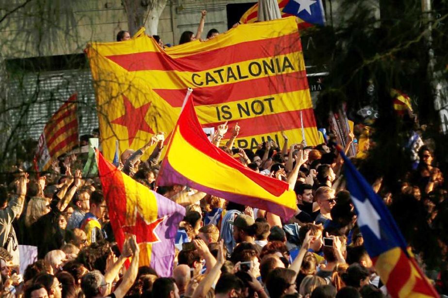 "Catalonia is not Spain"" reads a giant banner held up by protesters during a mass protest rally in Barcelona two days after the violence-hit referendum on independence."