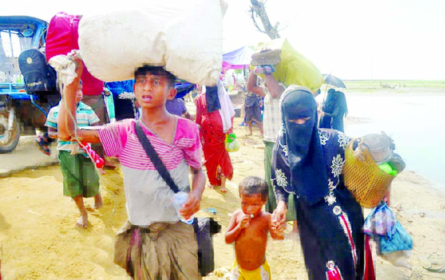 Hungry and exhausted, more Rohingyas entering BD border through Shahpory Island. This photo was taken on Thursday.