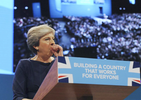 Conservative Party Leader and Prime Minister, Theresa May, coughs during her address to delegates at the Conservative Party Conference at Manchester Central, in Manchester, England.