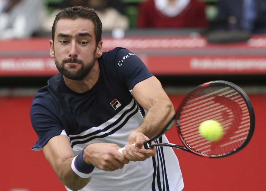 Marin Cilic of Croatia returns a shot to Adrian Mannarino of France during their men's singles semi-final match of the Japan Open tennis tournament in Tokyo on Saturday.