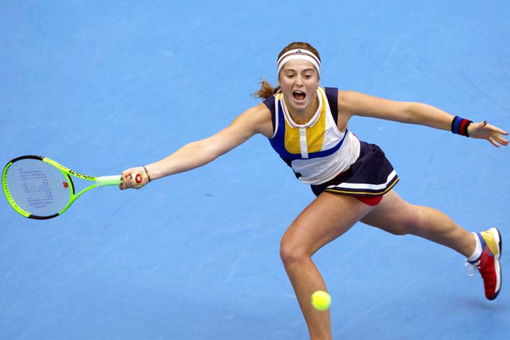 Jelena Ostapenko of Lativa returns a shot during a women's singles semi-final match against Simon Halep of Romania in the China Open tennis tournament at the Diamond Court in Beijing, China on Saturday.