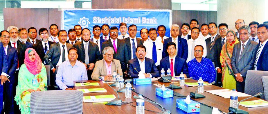 Muhammad Mijanur Rahman Jodder, Executive Director of Bangladesh Bank and Deputy Head of Bangladesh Financial Intelligence Unit (BFIU) poses with the participants of a daylong workshop on "AML Awareness Development Programme for BAMELCOs" organized by S