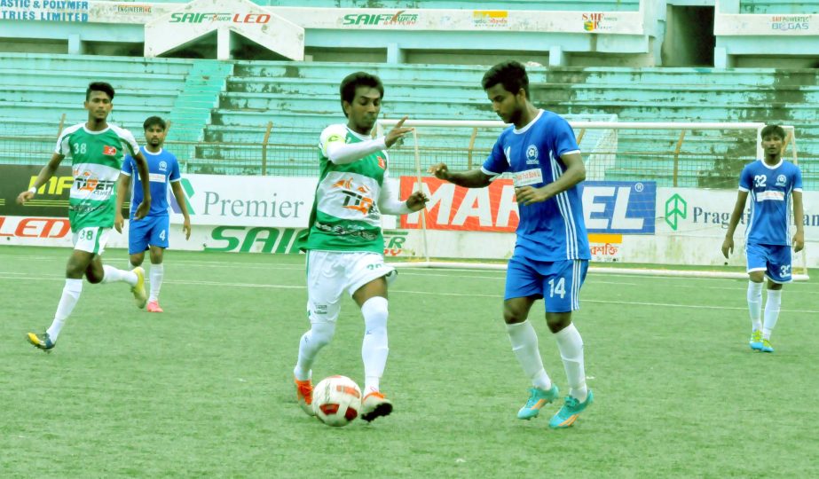 A moment of the match of the Marcel Bangladesh Championship League Football between Uttar Baridhara Club and Kawranbazar Progoti Sangha at the Bir Shreshtha Shaheed Sepoy Mohammad Mostafa Kamal Stadium in the city's Kamalapur on Sunday. The match ended i